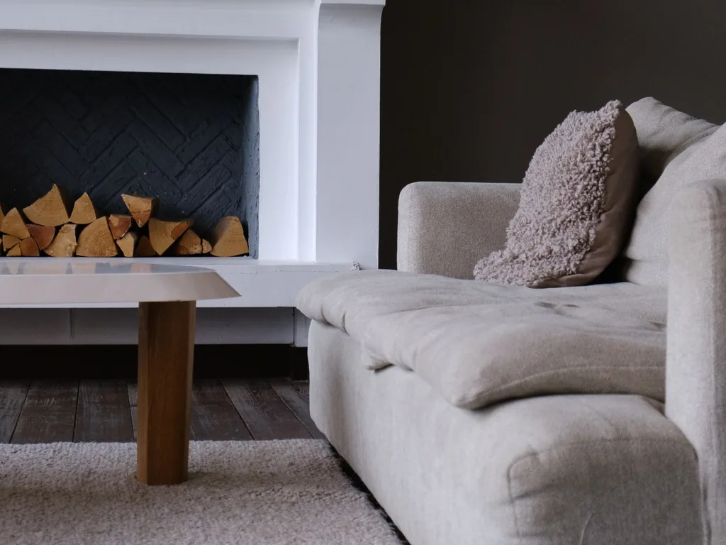 The same fireplace corner before the AI redesign shown behind this card — same camera angle, same room